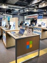 Multiple Microsoft Surface tablets and notebooks for sale at dedicated Microsoft stand inside FNAC French electronic