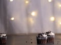 Multiple mini cupcakes with lights background Royalty Free Stock Photo