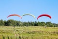 Paragliders are preparing to fly against the backdrop of the beautiful scenery Royalty Free Stock Photo