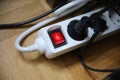 Multiple plug extension cord with the red button on Royalty Free Stock Photo