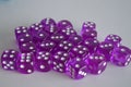 Multiple purple plastic arcylic d6 six sided die dice variable focus Royalty Free Stock Photo