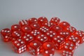 Multiple red plastic arcylic d6 six sided die dice variable focus Royalty Free Stock Photo