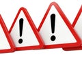 Multiple red triangle warning signs with exclamation marks in a row isolated on white background Royalty Free Stock Photo
