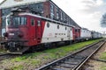 Multiple Red and white diesel locomotives in a row