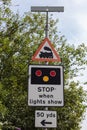 Multiple road traffic signs indicating level train crossing Birkenhead August 2019