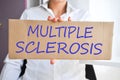 Multiple sclerosis concept with doctor holding a cardboard