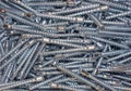 multiple screws and nuts on the surface of a metal sheet Royalty Free Stock Photo