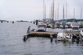 several small sail boats are docked at the dock near water, Sweden, Soelvesborg Royalty Free Stock Photo