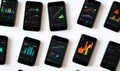 Multiple smartphones displaying data visualizations Royalty Free Stock Photo