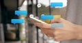 Multiple speech bubbles floating against mid section of caucasian woman using smartphone Royalty Free Stock Photo
