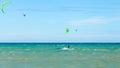 Multiple sports man flying on their kite boarding