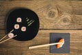 Multiple sushi rolls on old wooden background. Royalty Free Stock Photo