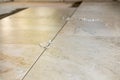 Multiple tile spacers in place on freshly installed new luxury tiles on the Royalty Free Stock Photo