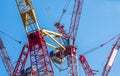 Multiple tower cranes above a concrete structure