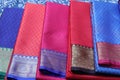 Multiple varieties of handwoven silk sarees in vibrant colors