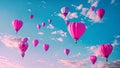 Multiple vibrant hot air balloons of various shapes and sizes can be seen flying gracefully through the sky, Heart-shaped hot air