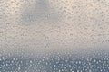 Multiple water drops or raindrops of different sizes on a window glass Royalty Free Stock Photo