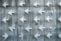 Multiple white arrows pointing the same direction on a concrete wall Royalty Free Stock Photo