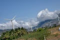 Multiple wind mills in a field in India Royalty Free Stock Photo