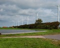 Wind turbines on agricultural farmland landscape in Petten (The Netherlands)