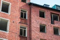 Multiple window openings in brick building facade.. Royalty Free Stock Photo