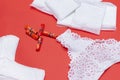 Women sanitary pads, daily pads, tampons, women`s white lace panties on on red background