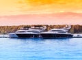 Multiple yacht boats at sunset river background Royalty Free Stock Photo