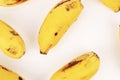 Multiple yellow bananas fill the frame creating full, tight pattern with white space separation Royalty Free Stock Photo