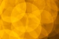 Multiple yellow bokeh lights with copy space on yellow background