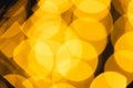 Multiple yellow bokeh lights with copy space on dark background