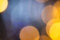 Multiple yellow bokeh lights with copy space on dark background