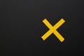 Multiplication yellow sign, symbol on black background