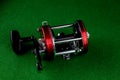 Multiplier Fishing Reel on a Green Felt Table Top Royalty Free Stock Photo