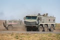 Multipurpose armored vehicle GAZ-233014 Tiger and Kamaz-63968 are moving in a military training ground