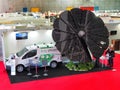 Multipurpose foldable solar power system Sunflower on dispaly in a fair to recharge electric vehicles at home