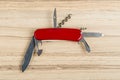 Multipurpose knife on wooden background Royalty Free Stock Photo