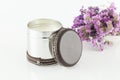 Multipurpose metal container decorated with leather. Used as a candle; photo on white background