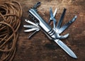 Multipurpose pocket knife on wooden background