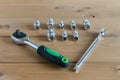 A multipurpose precision tool kit set box showing wrenches with different interchangeable bit head sizes arranged