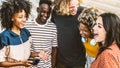 Multiracial best friends having fun laughing out loud outdoors - Group of young people enjoying summertime day out Royalty Free Stock Photo