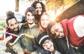 Multiracial best friends taking selfie at bmx skate park contest - Happy youth and friendship concept with young millenial people