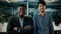 Multiracial business colleagues smiling diverse men arabian and african businessmen co-workers employees stand in office Royalty Free Stock Photo