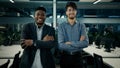 Multiracial business colleagues smiling diverse men arabian and african businessmen co-workers employees stand in office Royalty Free Stock Photo