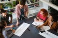 Multiracial business coworkers have fun cooperating together at office meeting. Teamwork concept Royalty Free Stock Photo