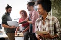 Multiracial business coworkers have fun cooperating together at office meeting. Teamwork concept Royalty Free Stock Photo