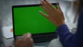 Multiracial coworkers team calling video chat using laptop green screen at desk. Royalty Free Stock Photo