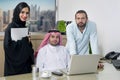 Multiracial Business Meeting in office , arabian businessman & arabian Secretary wearing hijab & a Foreigner meeting in office