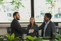 Multiracial business people hands shake for making agreement at coffee shop Royalty Free Stock Photo