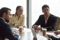 Multiracial business people at meeting in conference room negoti