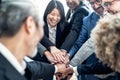 Multiracial business people stacking hands together in modern office Royalty Free Stock Photo